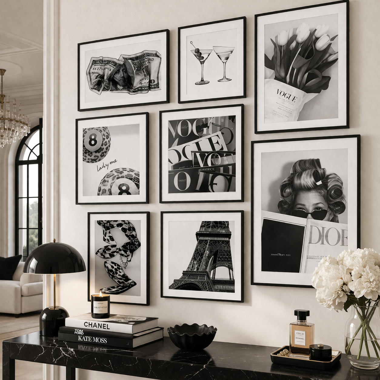 Wall with framed black and white art pieces in a stylish room.