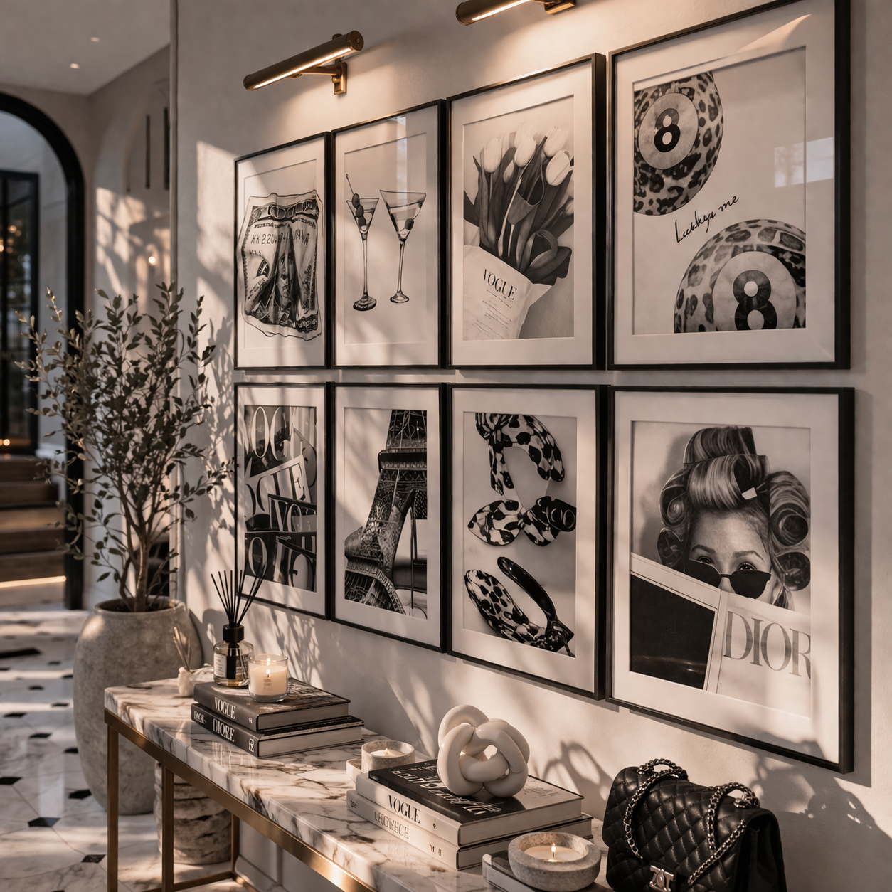 Wall with framed black and white art pieces in a stylish interior setting.