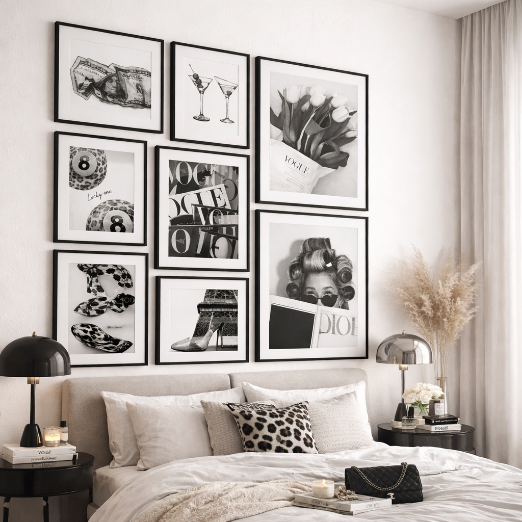 Decorative wall art in a bedroom setting with framed black and white photos.